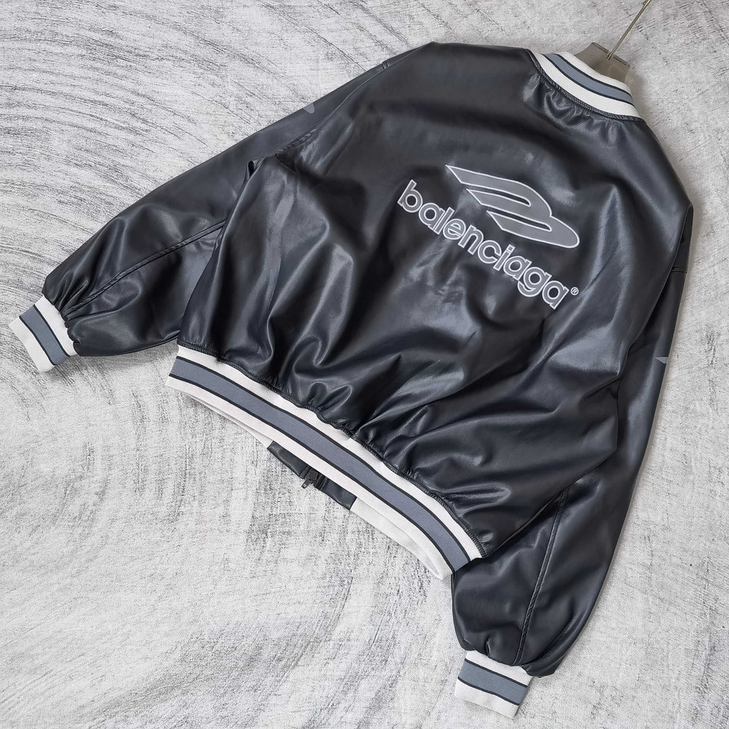 Balenciaga leather bomber jacket angled back view with balenciaga logo and ribbed cuffs