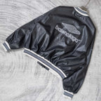 Balenciaga leather bomber jacket angled back view with balenciaga logo and ribbed cuffs