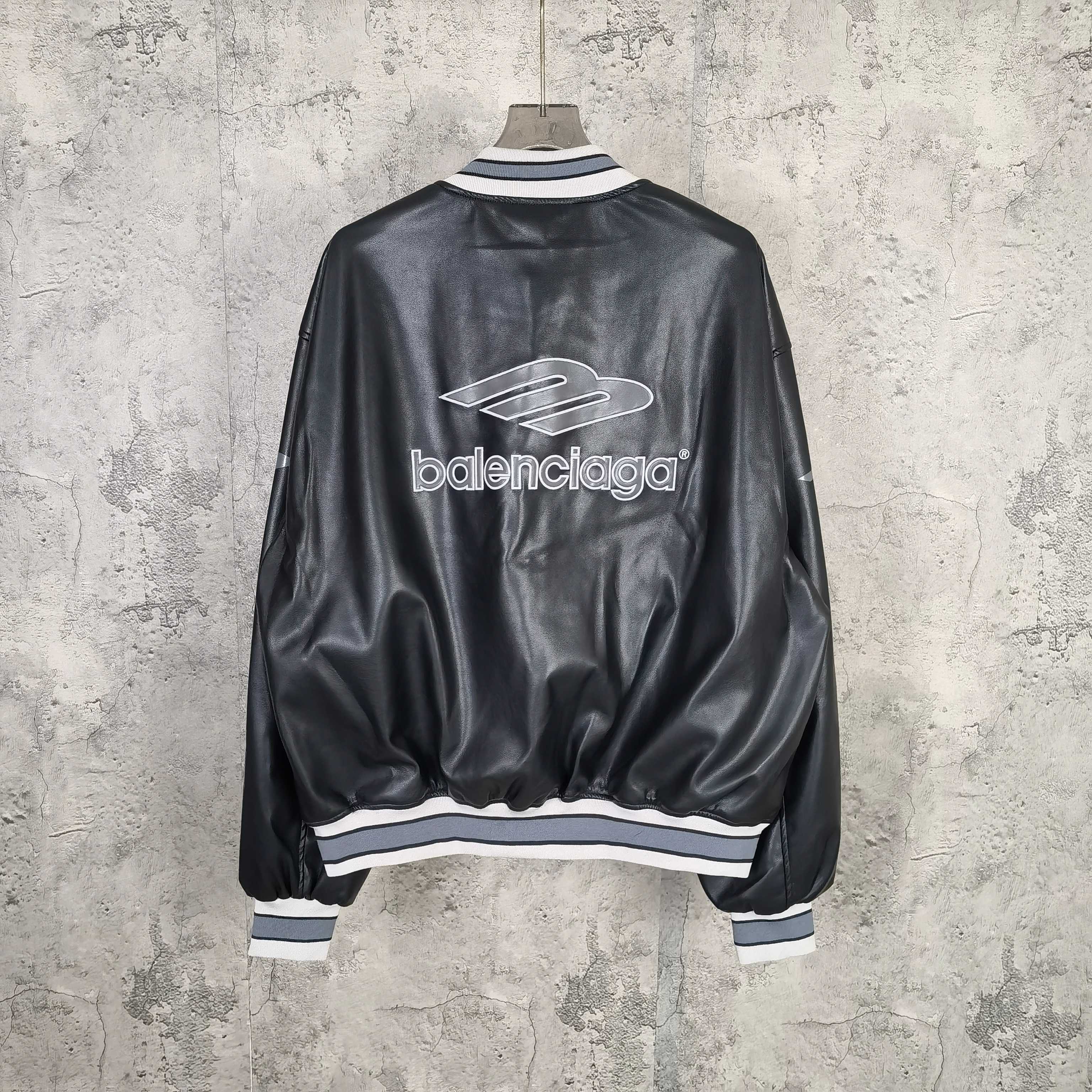 Balenciaga leather bomber jacket, back view with large balenciaga logo and rib trim