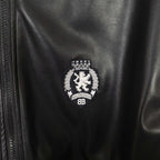 Balenciaga crest emblem on leather bomber jacket near the zipper