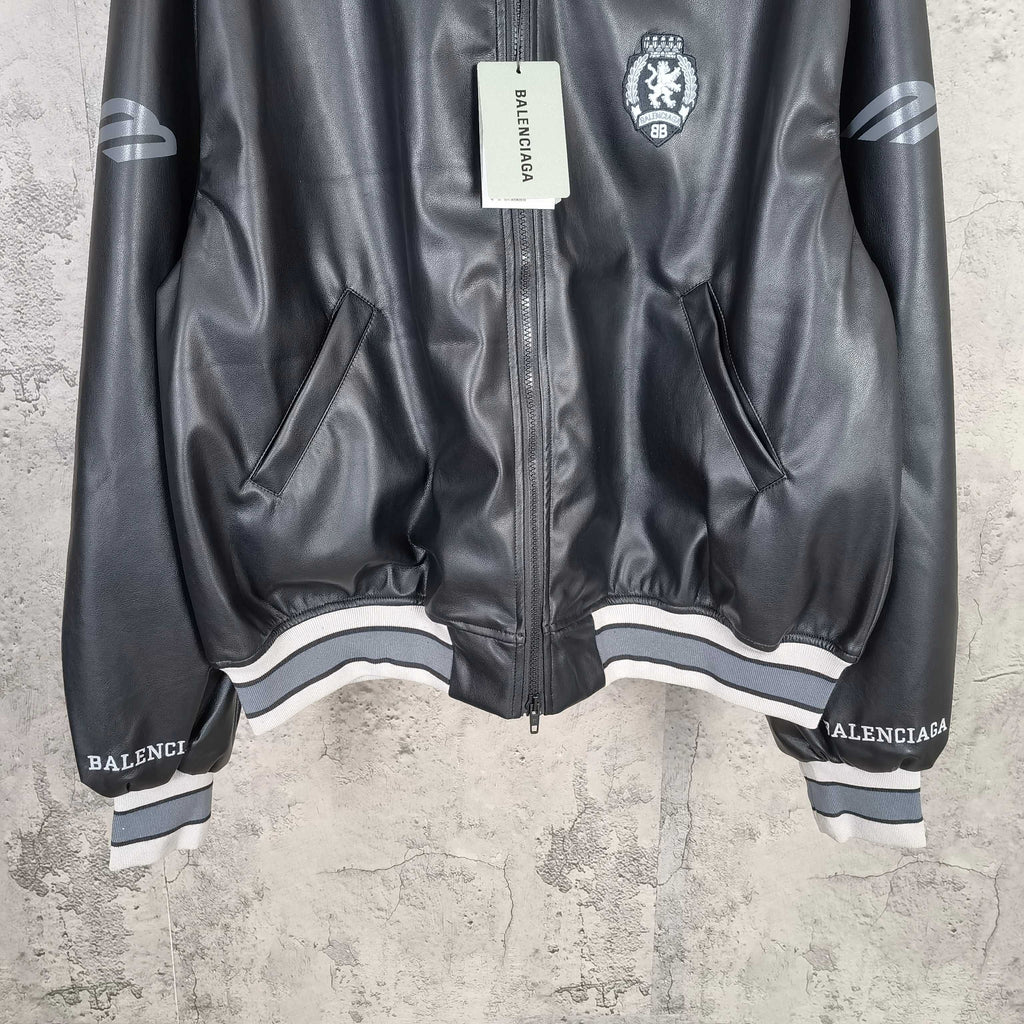 Balenciaga leather bomber jacket hem view with front zipper and striped ribbed cuffs