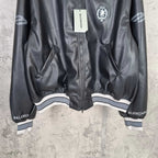 Balenciaga leather bomber jacket hem view with front zipper and striped ribbed cuffs