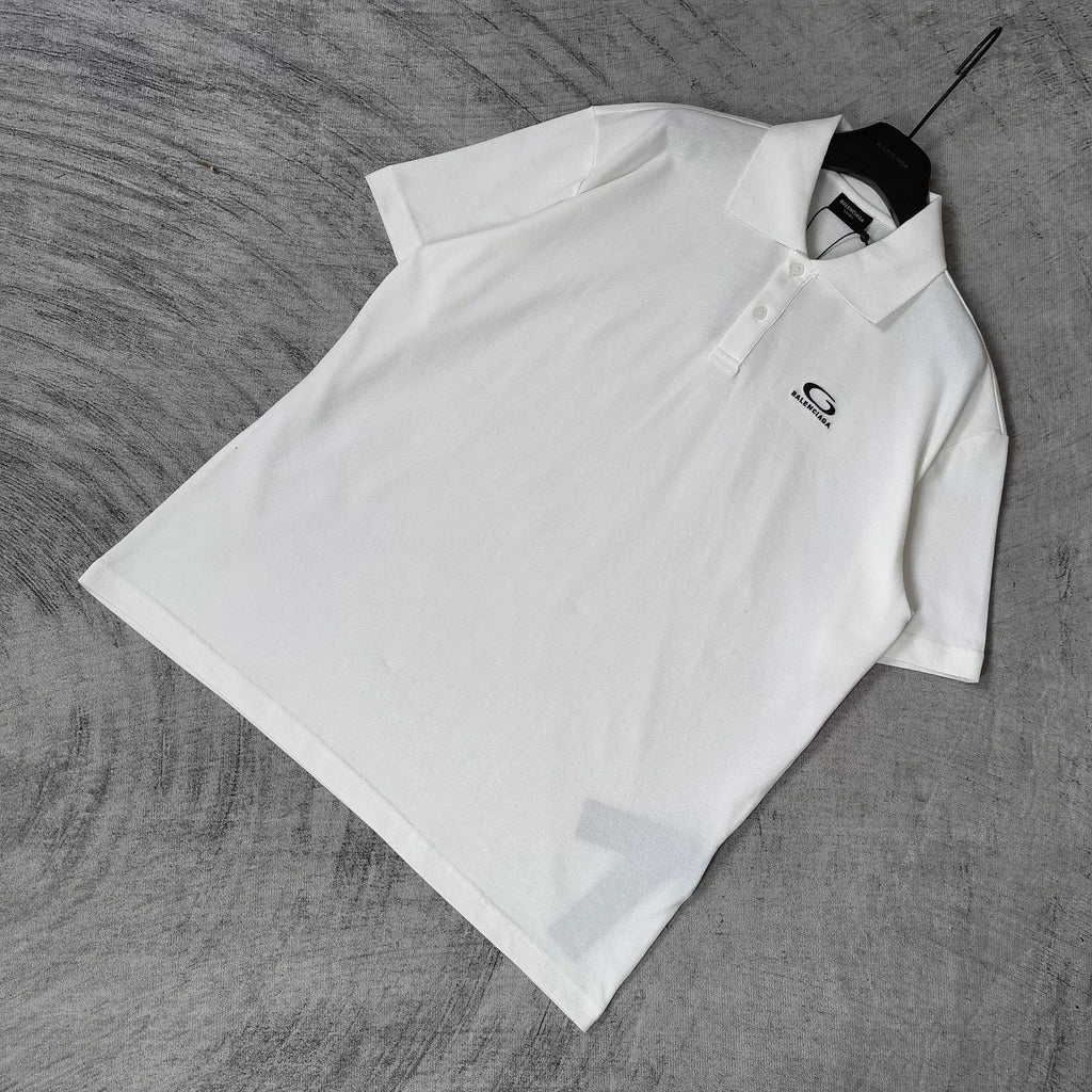 Balenciaga white polo shirt with collar and short sleeves, chest logo embroidery visible