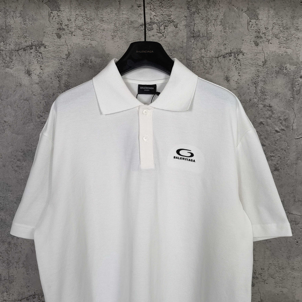 Balenciaga white polo shirt with collar, button placket, and chest logo detail