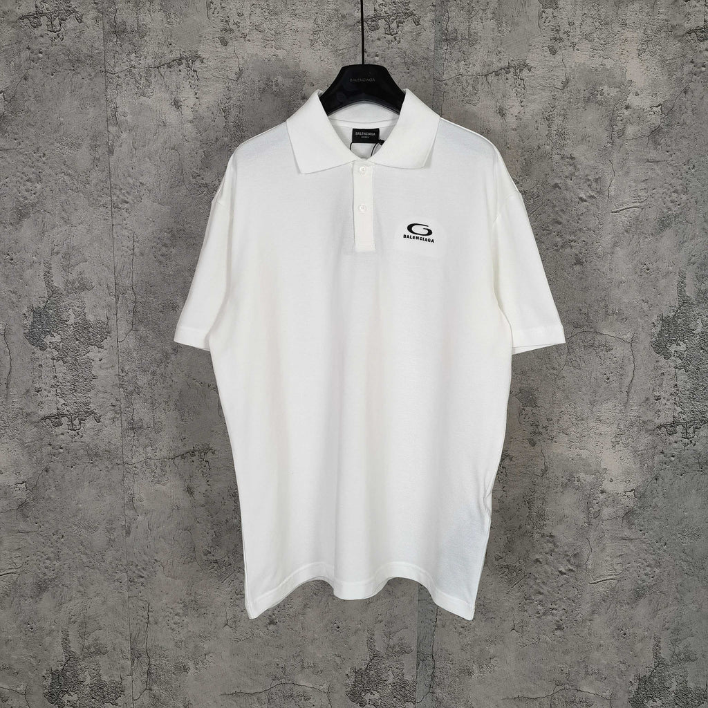 Balenciaga white polo shirt with button placket and embroidered logo on chest