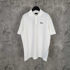 Balenciaga white polo shirt with button placket and embroidered logo on chest