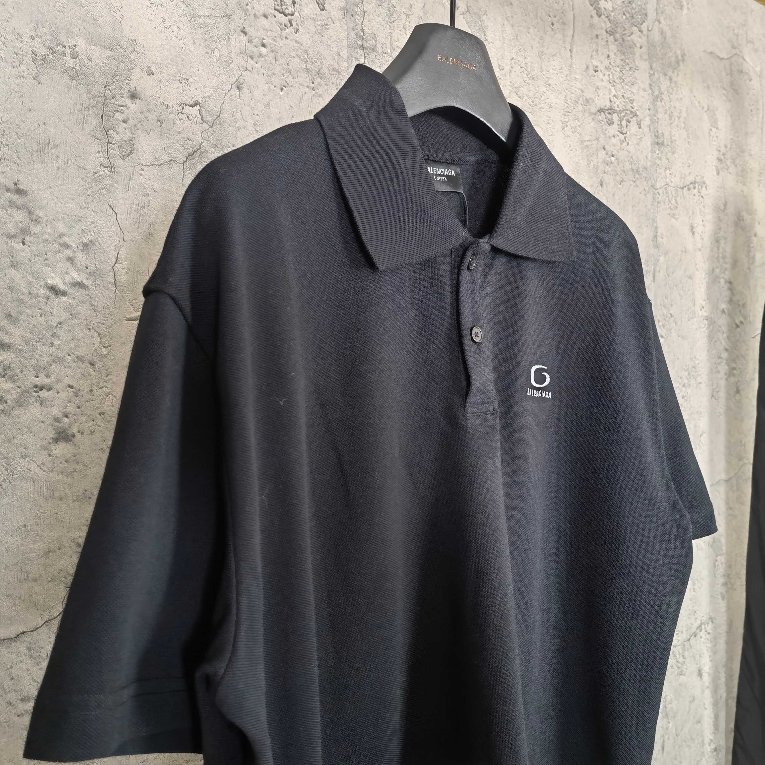 Balenciaga polo shirt, dark color, close front view with collar and logo