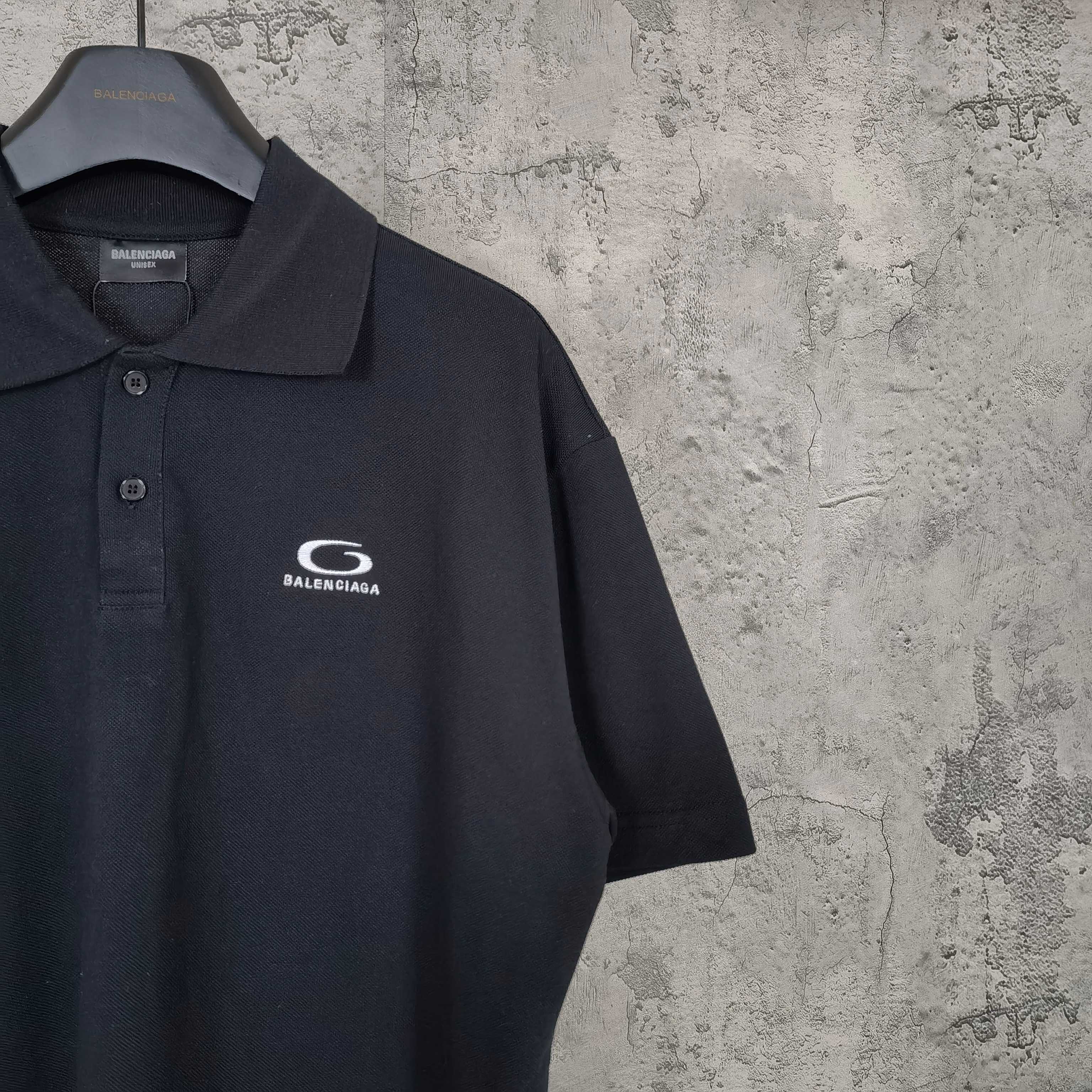 Balenciaga polo shirt, dark color, close front view with chest logo and collar