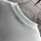 Amiri white T-shirt neckline close-up with neat topstitching at the collar