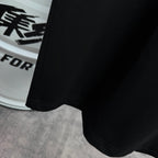 Black T-shirt hem with stitched bottom edge