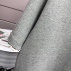 Heather gray T-shirt sleeve close-up with soft knit texture.