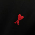Black T-shirt with red heart logo embroidery