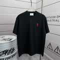 Black crew-neck short-sleeve T-shirt with red logo on the left chest