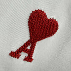 Amiri white T-shirt with embroidered red heart-and-A emblem on textured knit