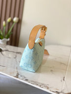 Louis Vuitton light blue monogram mini handbag with tan top handle and side strap