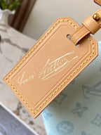 Louis Vuitton tan leather ID label patch on light blue monogram handbag strap