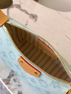 Louis Vuitton light blue monogram bag interior view with brown lining and gold zipper