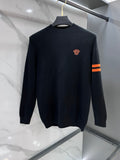 Versace knit sweater in dark navy with red chest logo and striped sleeve detail