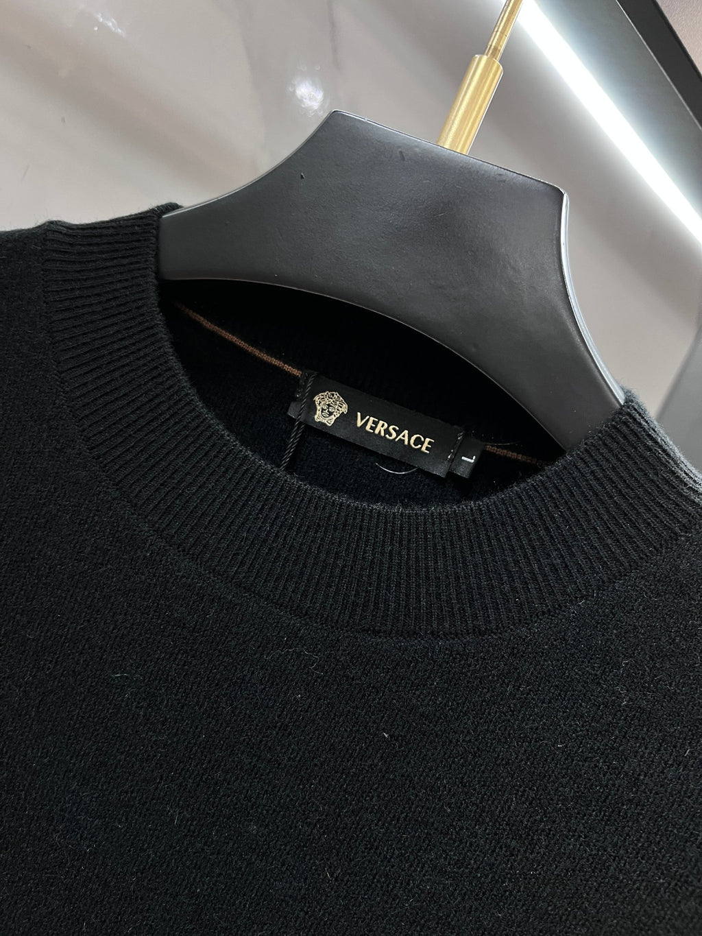 Versace knit sweater collar in dark navy with VERSACE label at neckline