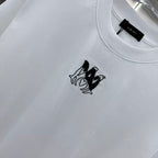Amiri white T-shirt close-up of black logo print on chest