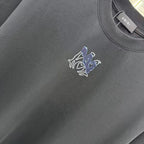 Charcoal crew-neck T-shirt with small blue-and-white horse graphic