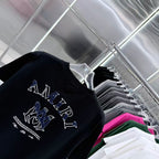 Black crew-neck T-shirt with large AMIRI lettering and horse graphic