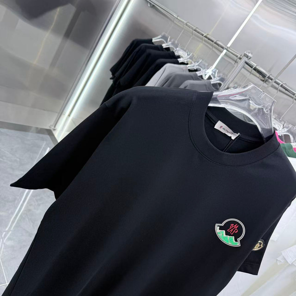 Black short-sleeve T-shirt with round neckline and Moncler crest emblem