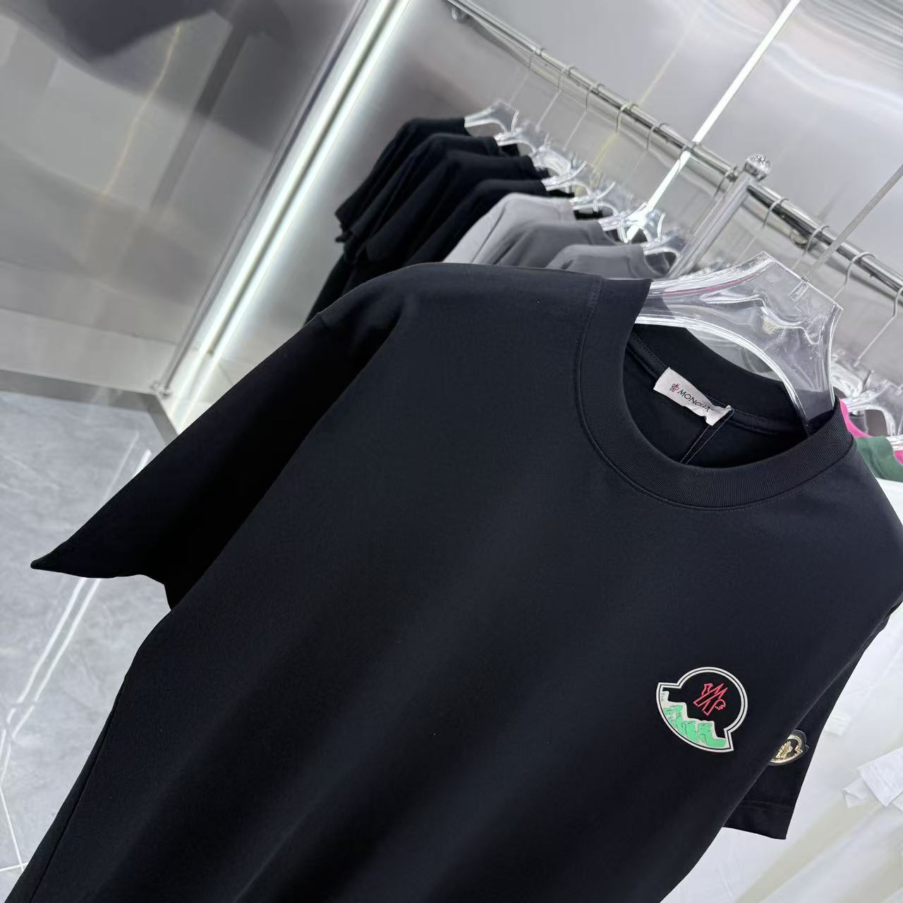 Black short-sleeve T-shirt with round neckline and Moncler crest emblem