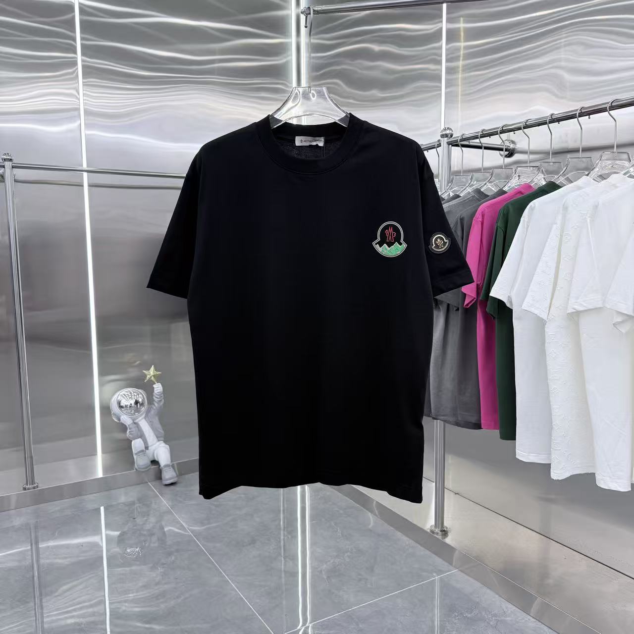 Black short-sleeve T-shirt with Moncler crest patches on chest