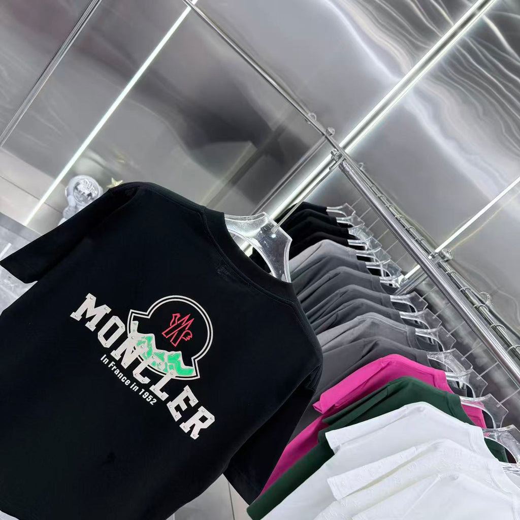 Black short-sleeve Moncler T-shirt with large crest and logo print on front