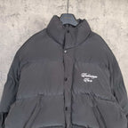 Long hooded puffer jacket in dark gray with chest logo and front buttons