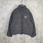 Long hooded puffer jacket in dark gray with front button placket and chest logo