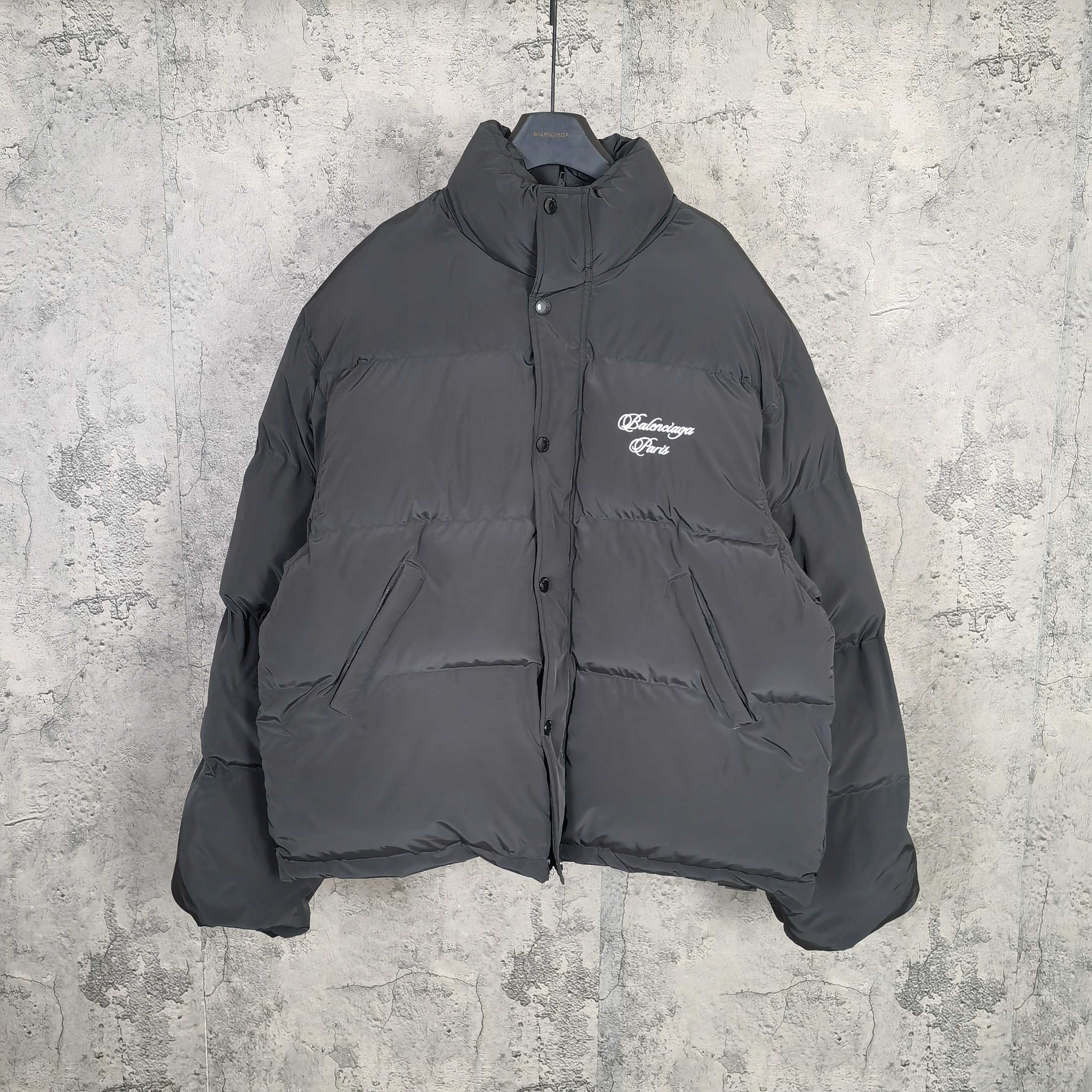Long hooded puffer jacket in dark gray with front button placket and chest logo