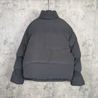 Long hooded puffer jacket, dark gray, with high neck and buttoned front