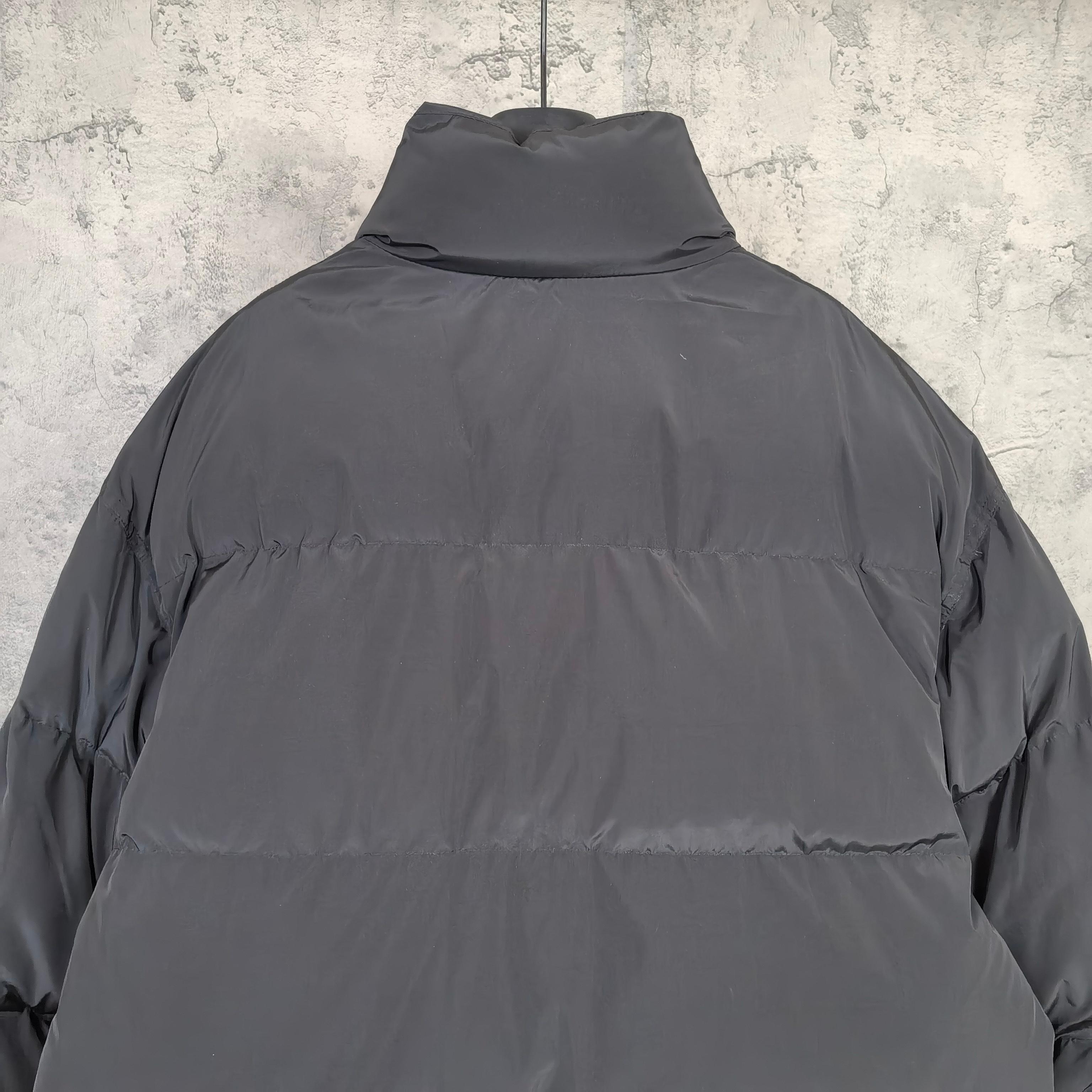 Long hooded puffer jacket in dark gray, back view with high neck