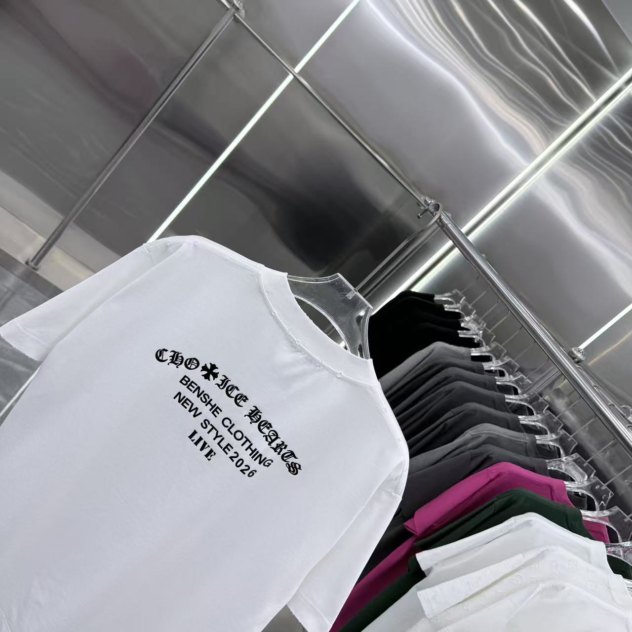 White short-sleeve T-shirt angled view with back graphic text logo