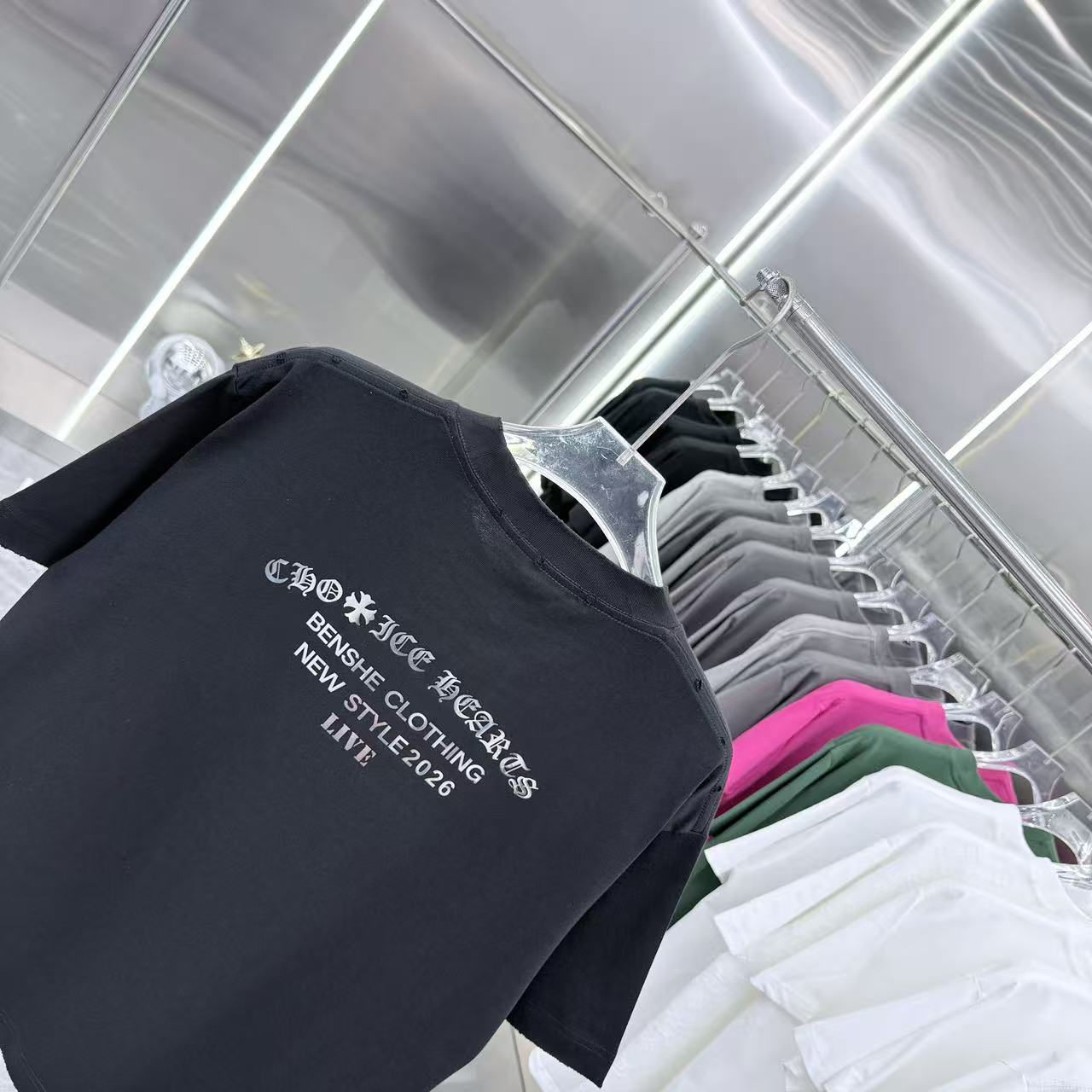 Black short-sleeve T-shirt angled view with chest graphic print