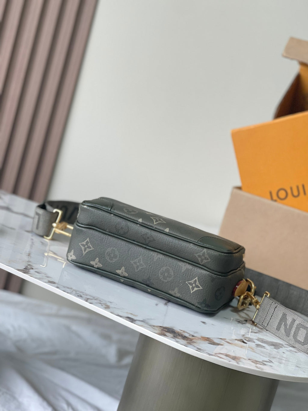Louis Vuitton mini shoulder bag in dark green monogram canvas with gold-tone accents
