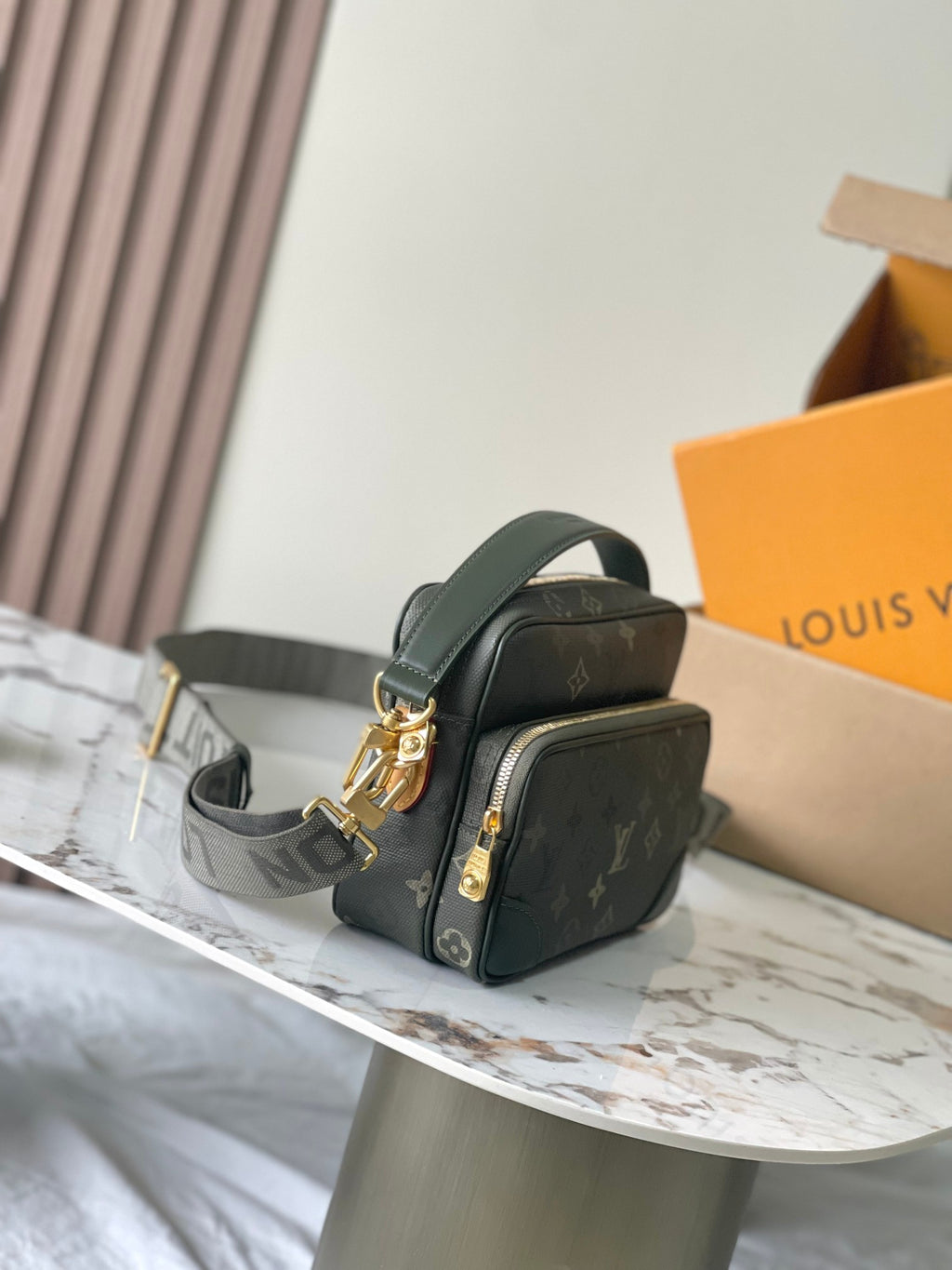 Louis Vuitton crossbody bag with flap-style front pocket, dark green monogram canvas
