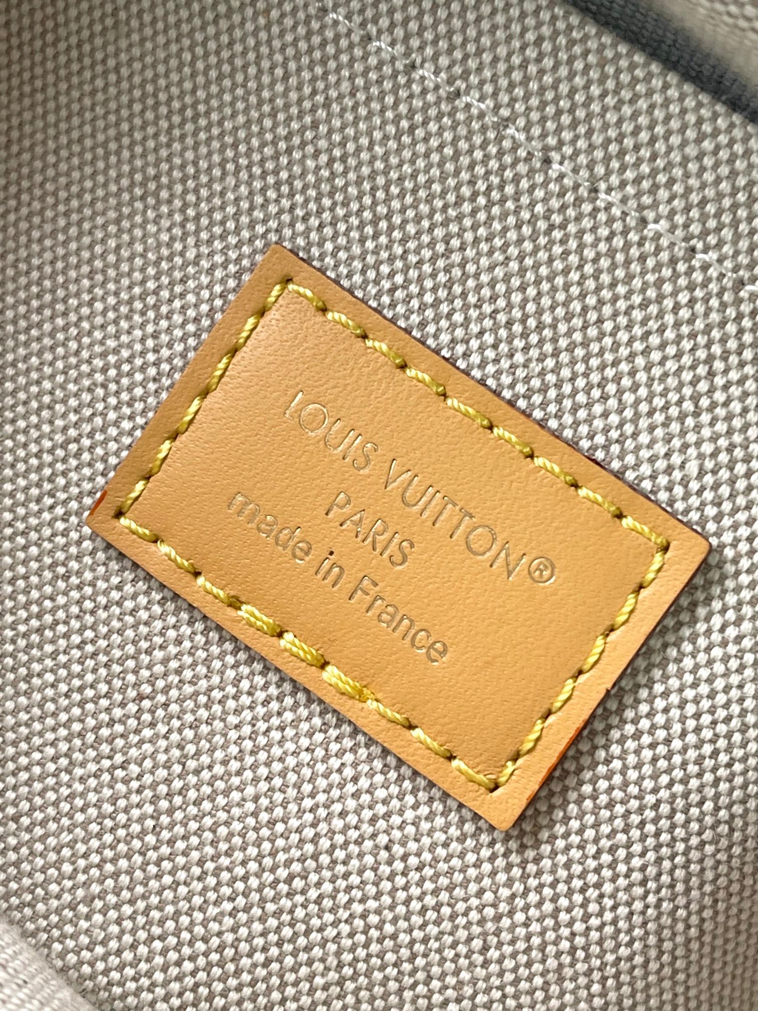 Louis Vuitton Paris label leather patch on dark green monogram canvas