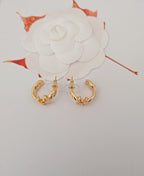 Gold-tone Chanel hoop earrings with CC logo and charm accents