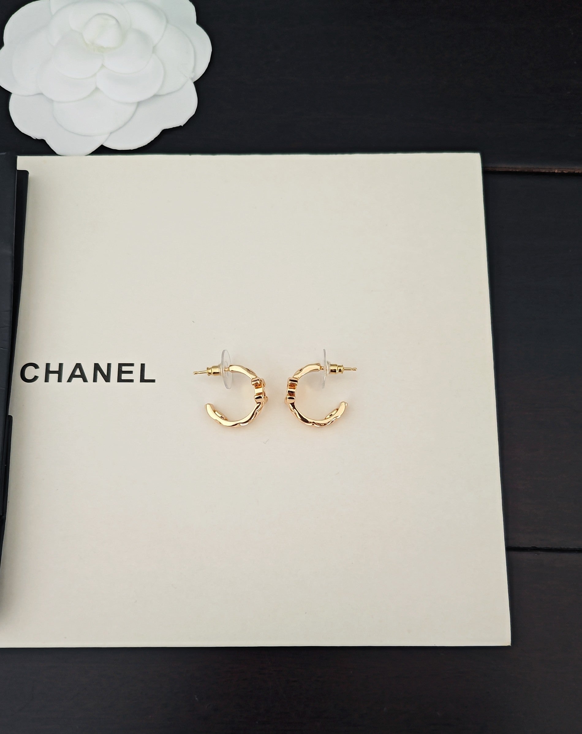 Gold-tone Chanel C-hoop earrings with small logo charm