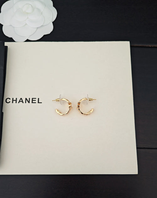 Gold-tone Chanel C-hoop earrings with small logo charm