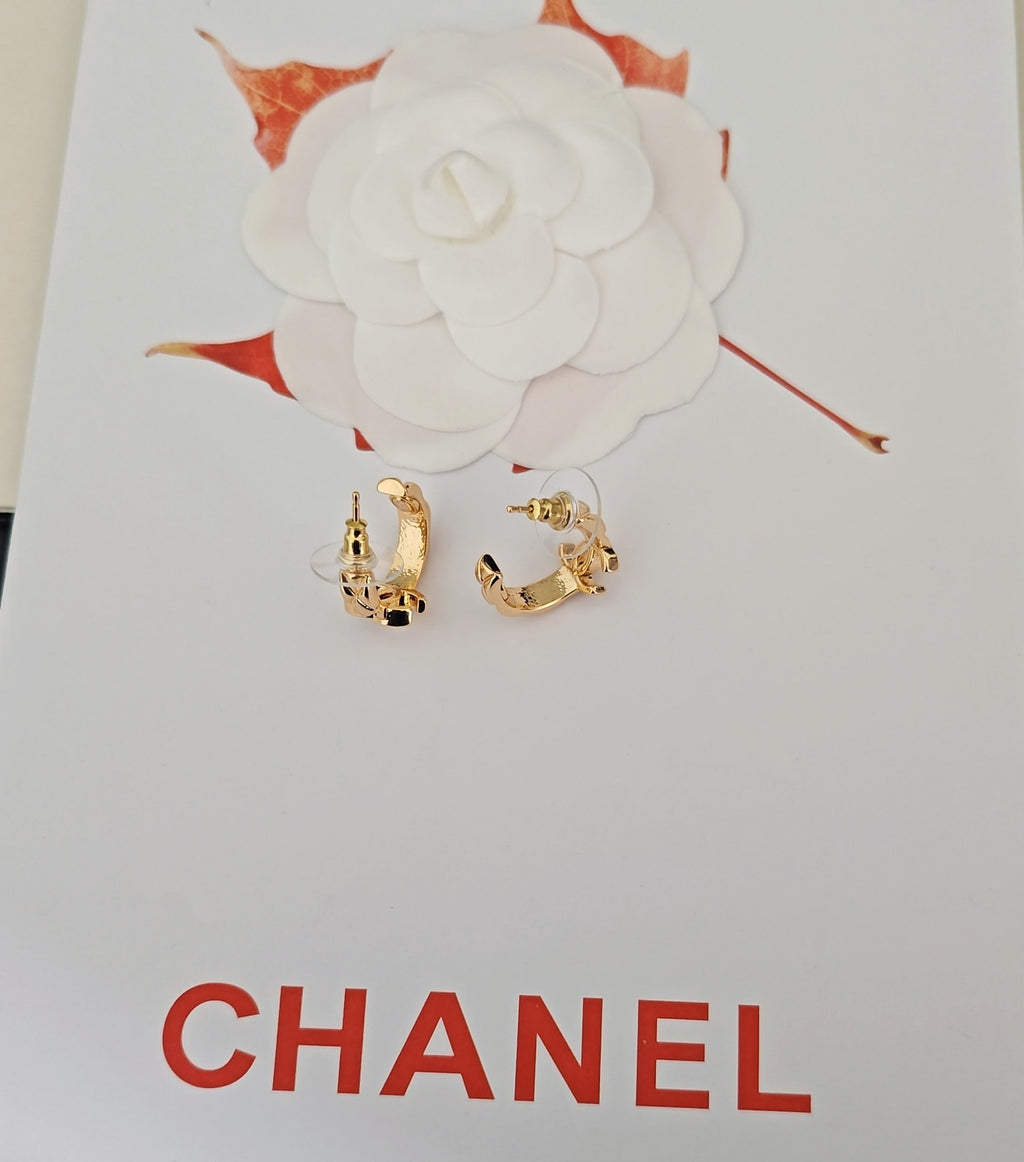 Gold-tone Chanel hoop earrings with small charm detail
