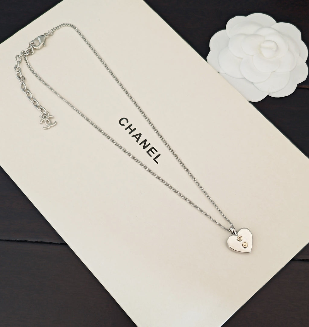 Silver-tone dual chain necklace with heart pendant and small logo charm