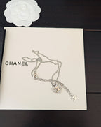 Silver-tone chain necklace with CC logo and dangling charm accents