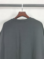 Dark crewneck T-shirt back view with round neckline, no front graphics