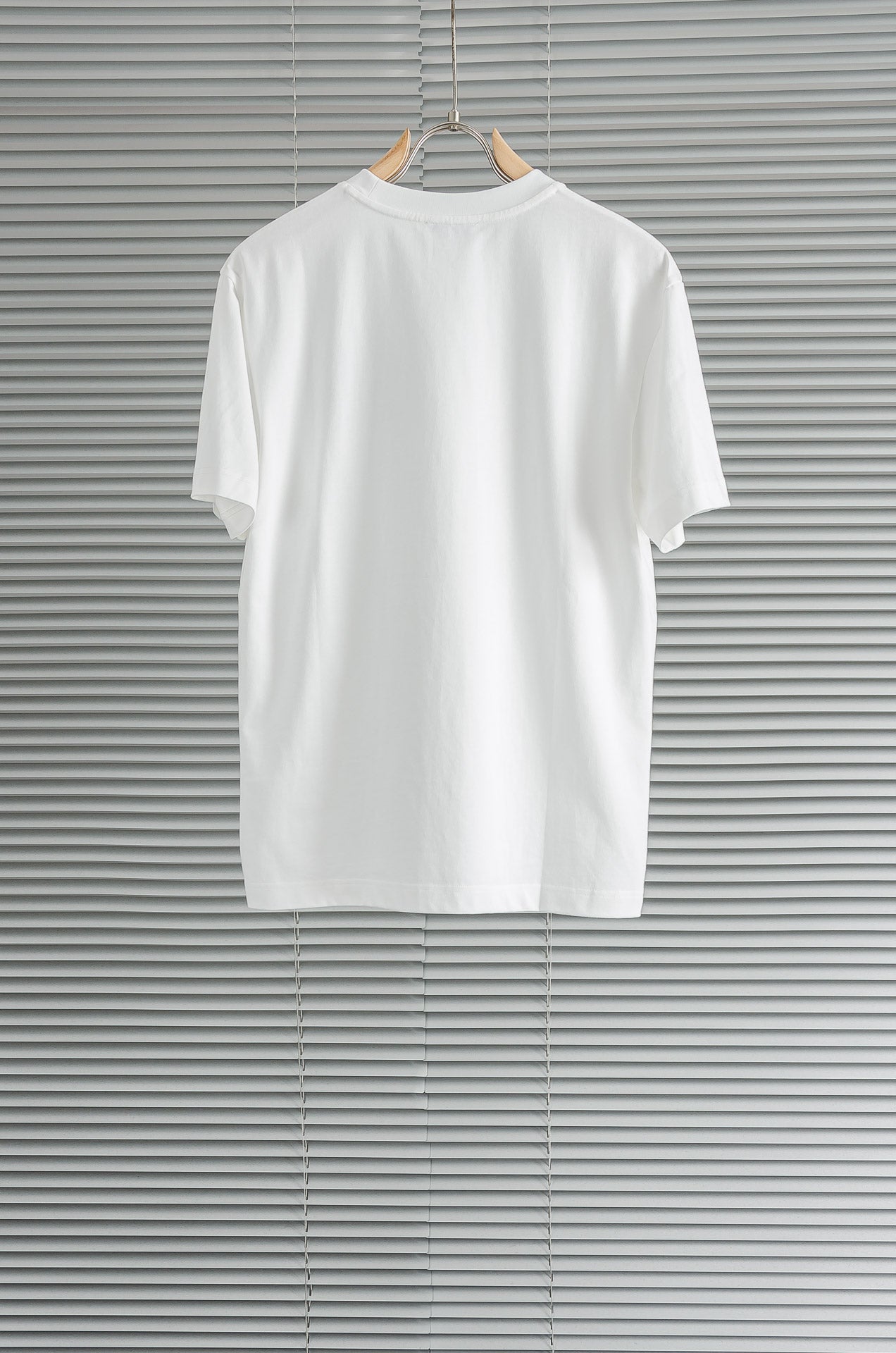 Versace white T-shirt front view with crew neck and no other visible graphics