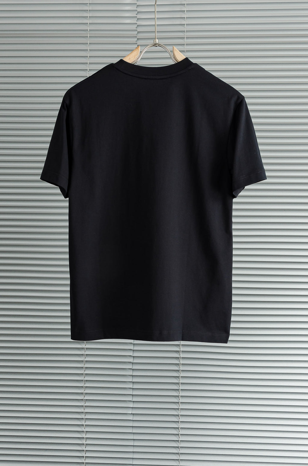 Black crew-neck T-shirt shown from the back