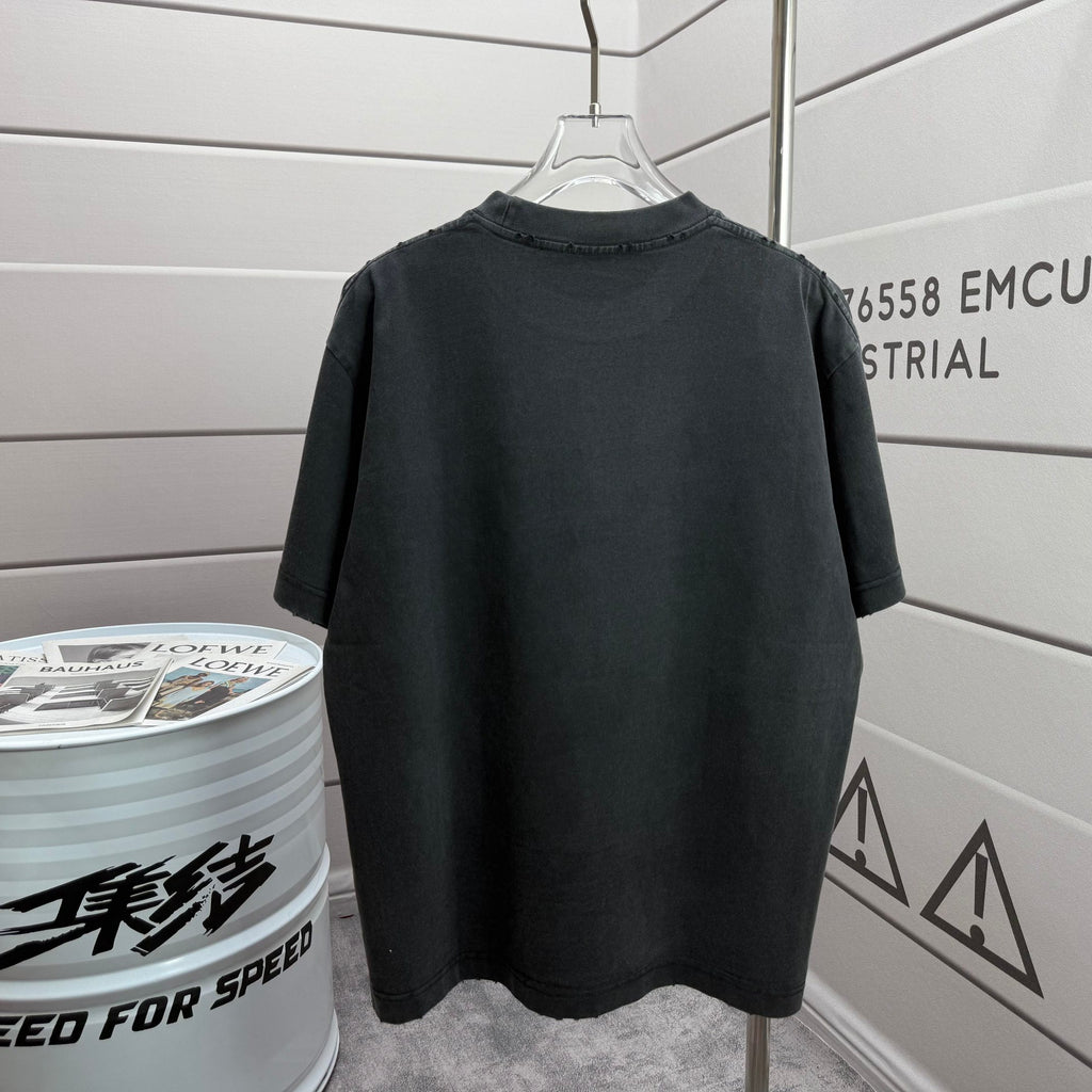 Back view of a short-sleeve T-shirt on a hanger, dark black fabric